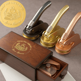 Premium Box for Embosser - Wooden Embosser Storage Box with drawer organizer, shown with gold, black, and copper embossing stamps.