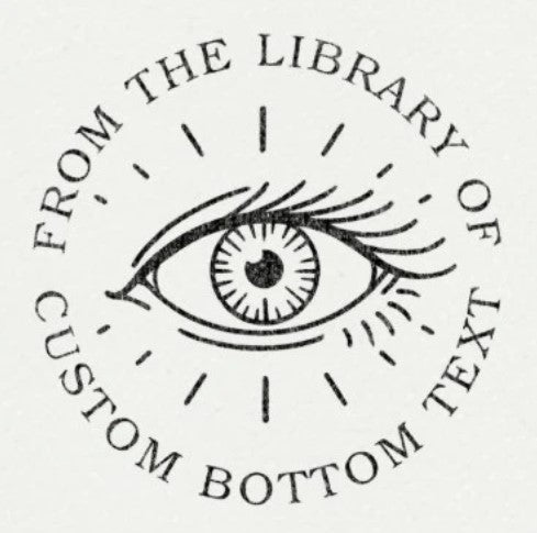 Custom Book Embosser by ChicCraft featuring an illustrated eye design with 'From the Library Of' and customizable bottom text. Ideal for book lovers.