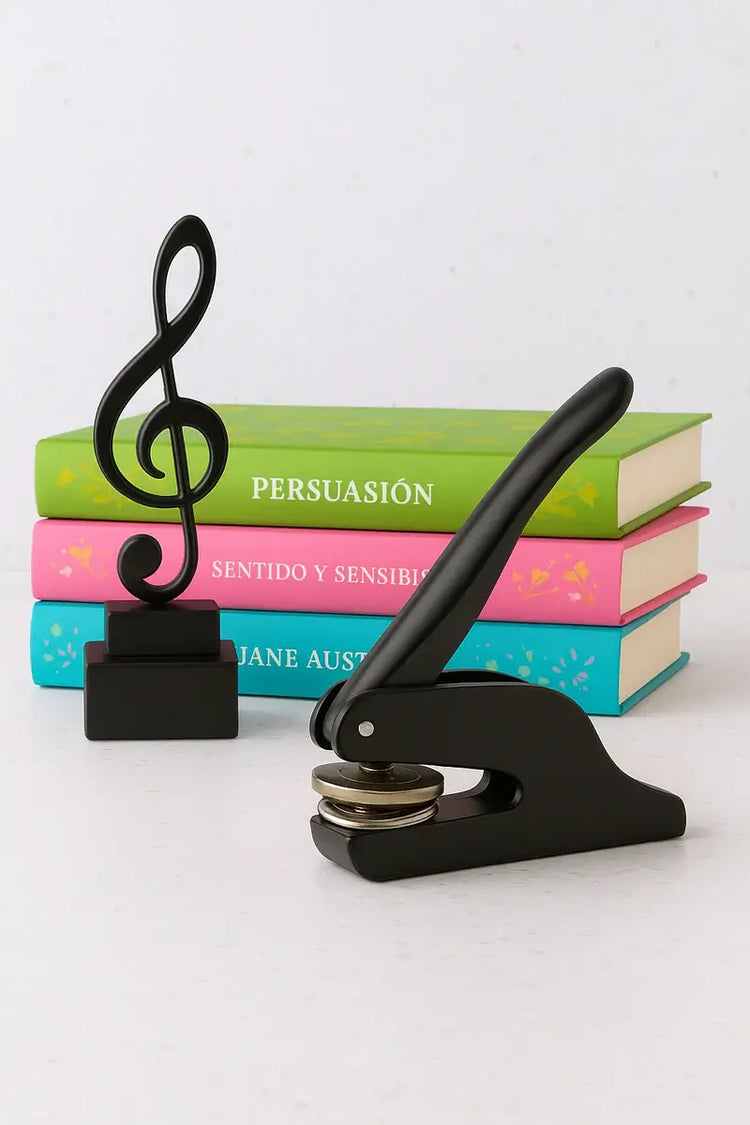 Black press with music note design on top of books